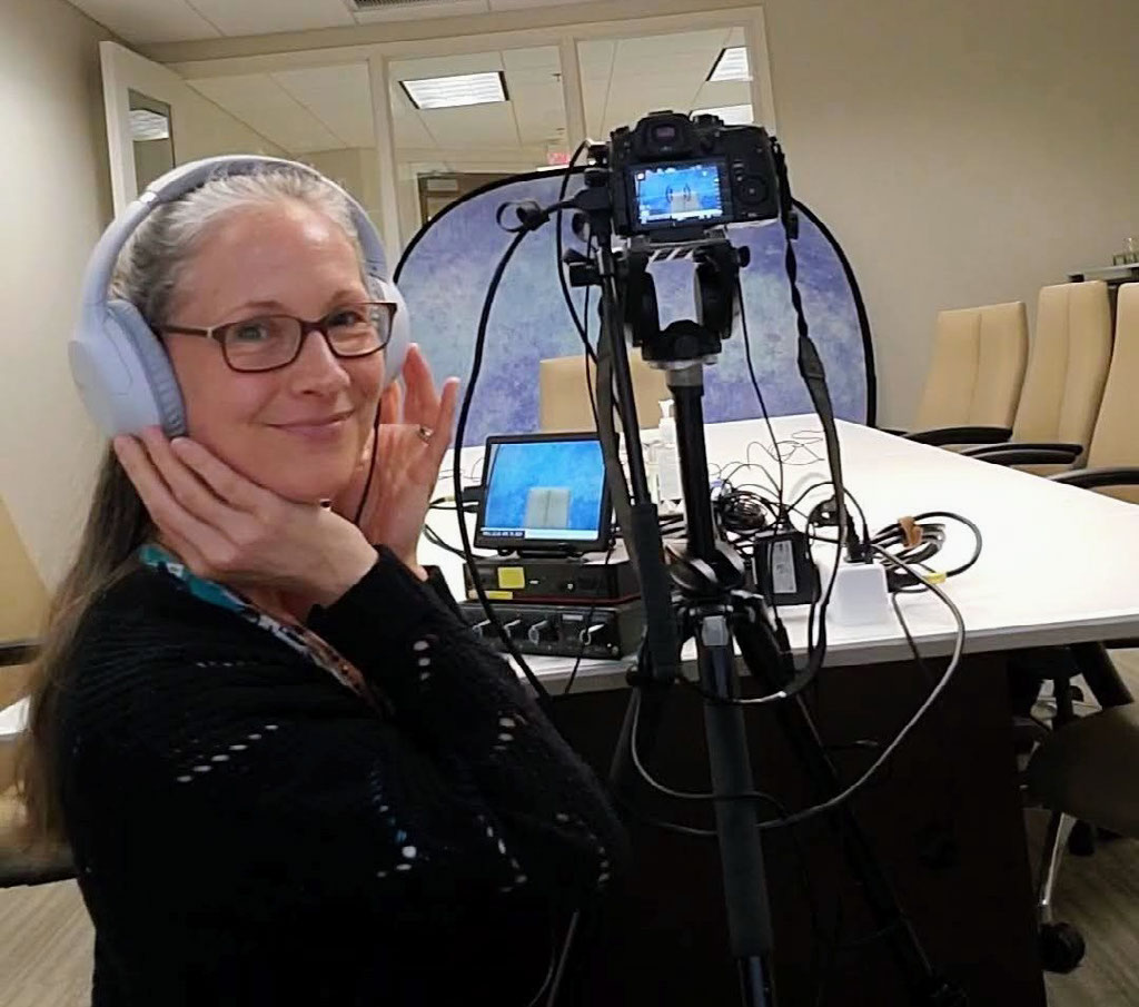 Jaime behind the broadcast deposition camera